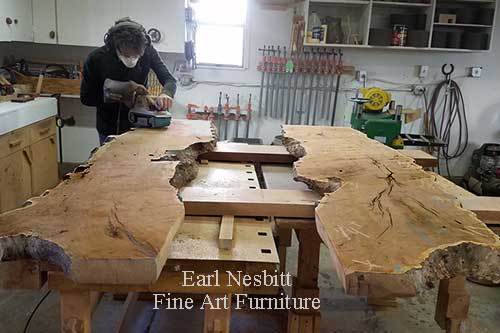 Earl rough sanding mesquite slabs for custom made live edge dining table